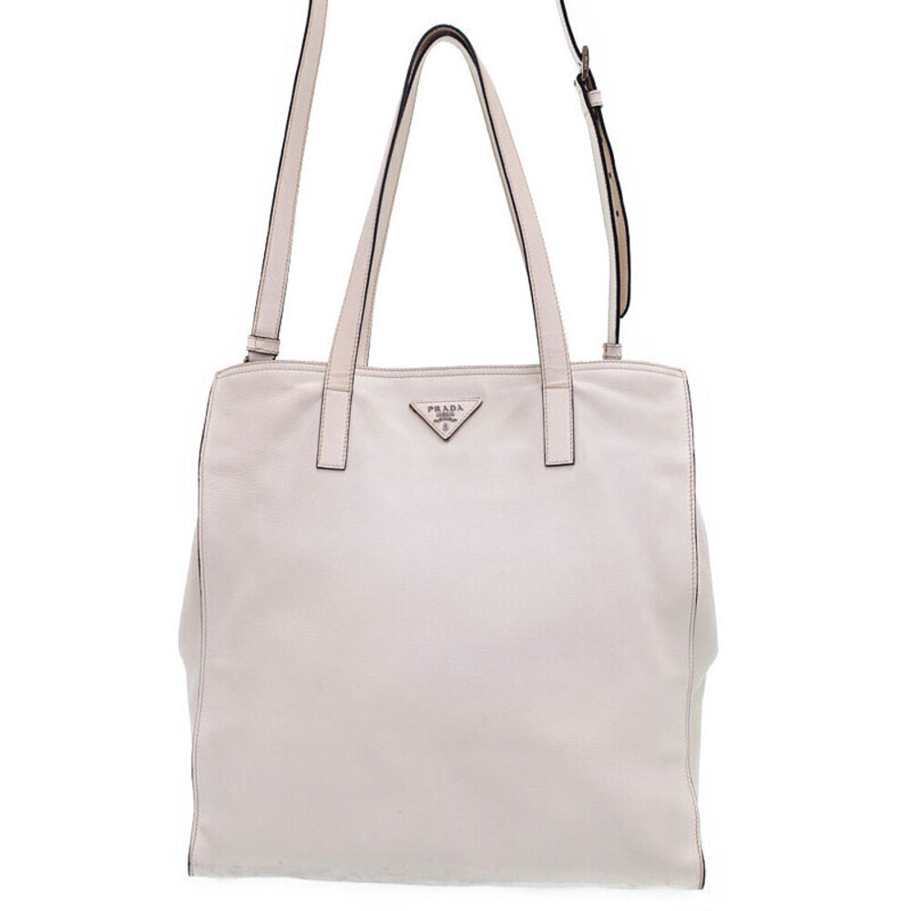 Prada tote bag refined leather features subtle triangular logo plaque White